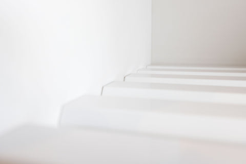 Closeup detail of aluminium slat white linen shelf