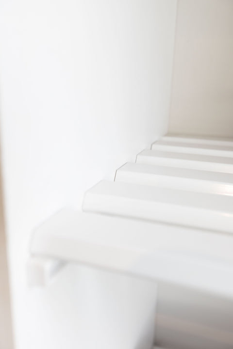 detail photo of white aluminium slat linen shelving